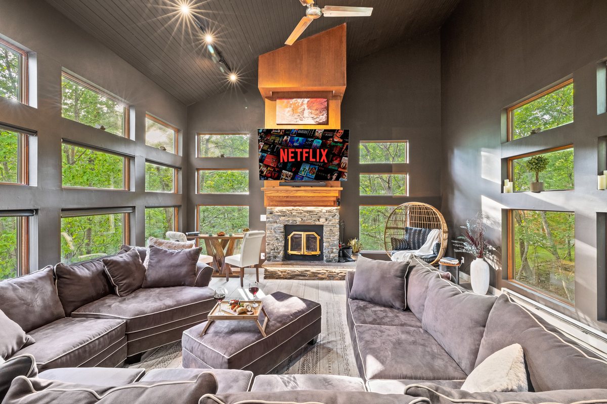 Living room window wall and gathering space at Waterfall Wonder.