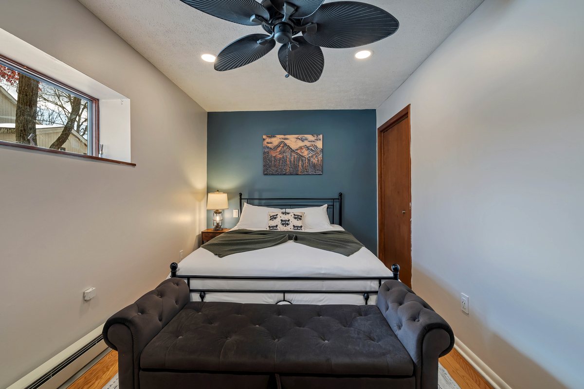 Raccoon Room at Waterfall Wonder with a queen bed.